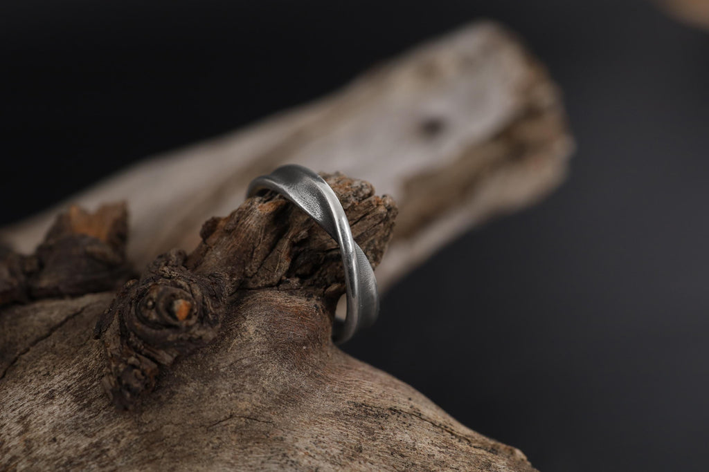Mobius ring, infinity ring, twisted band ring, rhodium plated silver ring, and minimalist symbolic jewelry designed for those who are drawn to continuity, balance, and modern elegance. This striking ring features a seamless Mobius twist structure, enhanced with a bright rhodium finish that creates a sleek, polished, and contemporary look.