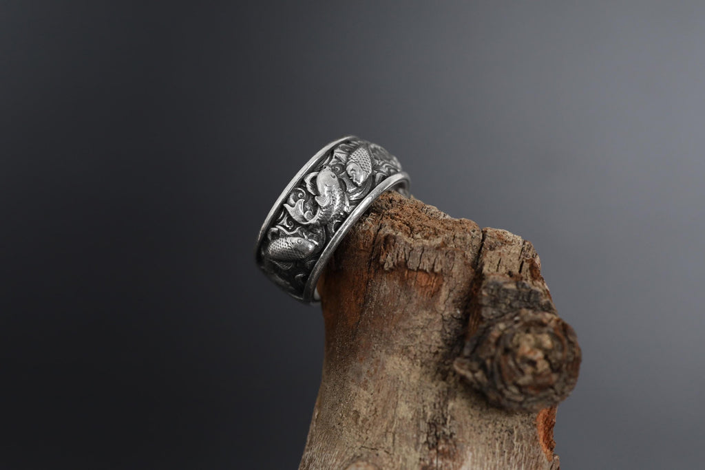 This Koi fish ring for men is a bold and meaningful design created for those who are drawn to Japanese jewelry, symbolic rings, engraved bands, nature-inspired accessories, and statement gold rings. Featuring detailed Koi carp motifs flowing across the band, this ring represents perseverance, transformation, strength, luck, and forward movement.