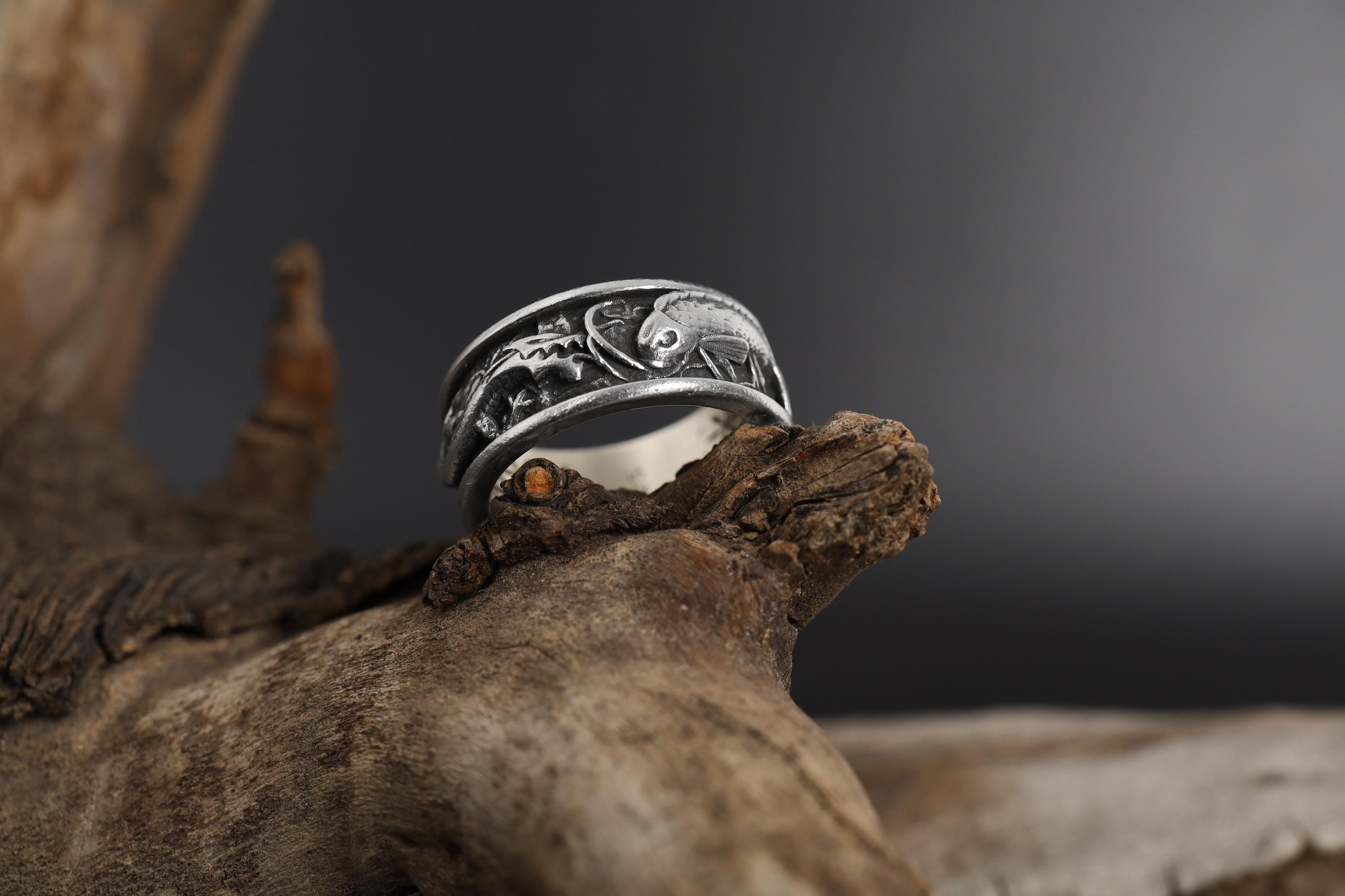 Koi Fish and Dragon Band Ring, sterling silver Japanese mythology jewelry, symbolic dragon and koi statement band, and handcrafted bold accessory designed for those who are drawn to perseverance, transformation, strength, and spiritual balance. This striking ring features a detailed Koi fish and Dragon motif wrapped around a bold band structure, creating a look that feels powerful, artistic, and deeply meaningful