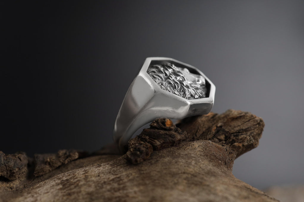 African lion signet ring, sterling silver safari animal jewelry, symbolic king lion statement band, and handcrafted bold accessory designed for those who are drawn to courage, leadership, and untamed strength. This striking ring features a detailed African lion motif framed within a bold signet structure, creating a look that feels regal, masculine, and deeply symbolic