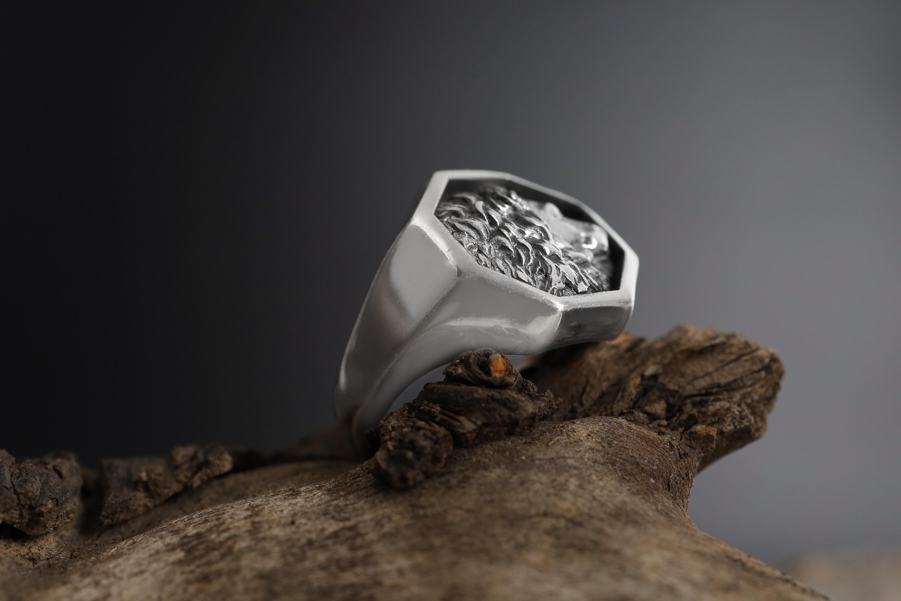 African lion signet ring, sterling silver safari animal jewelry, symbolic king lion statement band, and handcrafted bold accessory designed for those who are drawn to courage, leadership, and untamed strength. This striking ring features a detailed African lion motif framed within a bold signet structure, creating a look that feels regal, masculine, and deeply symbolic