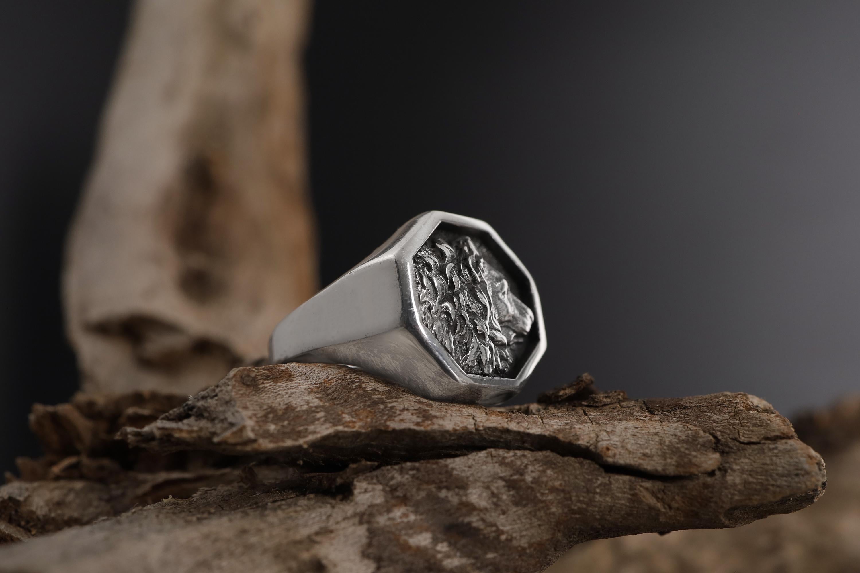 African lion signet ring, sterling silver safari animal jewelry, symbolic king lion statement band, and handcrafted bold accessory designed for those who are drawn to courage, leadership, and untamed strength. This striking ring features a detailed African lion motif framed within a bold signet structure, creating a look that feels regal, masculine, and deeply symbolic