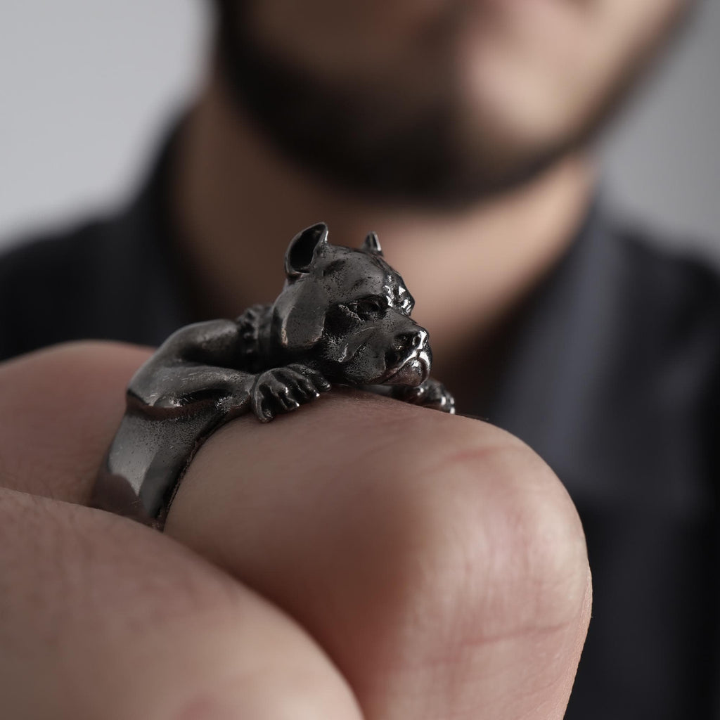 Pitbull head ring, dog inspired statement jewelry, symbolic warrior accessory, and handcrafted bold band designed for those who are drawn to loyalty, strength, and fearless character. This striking ring features a detailed pitbull head motif with muscular facial details and textured engraving, creating a powerful appearance inspired by the strong and protective nature of the pitbull breed.