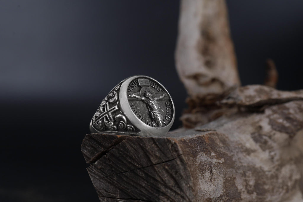 Jesus Crucifix ring, faith inspired religious jewelry, symbolic Christian statement band, and handcrafted bold accessory designed for those who are drawn to devotion, spirituality, faith, and timeless Christian symbolism. This striking ring features a detailed depiction of Jesus on the Holy Crucifix, carefully engraved onto a bold signet face, creating a powerful appearance inspired by Christian tradition, sacred art, and enduring faith.