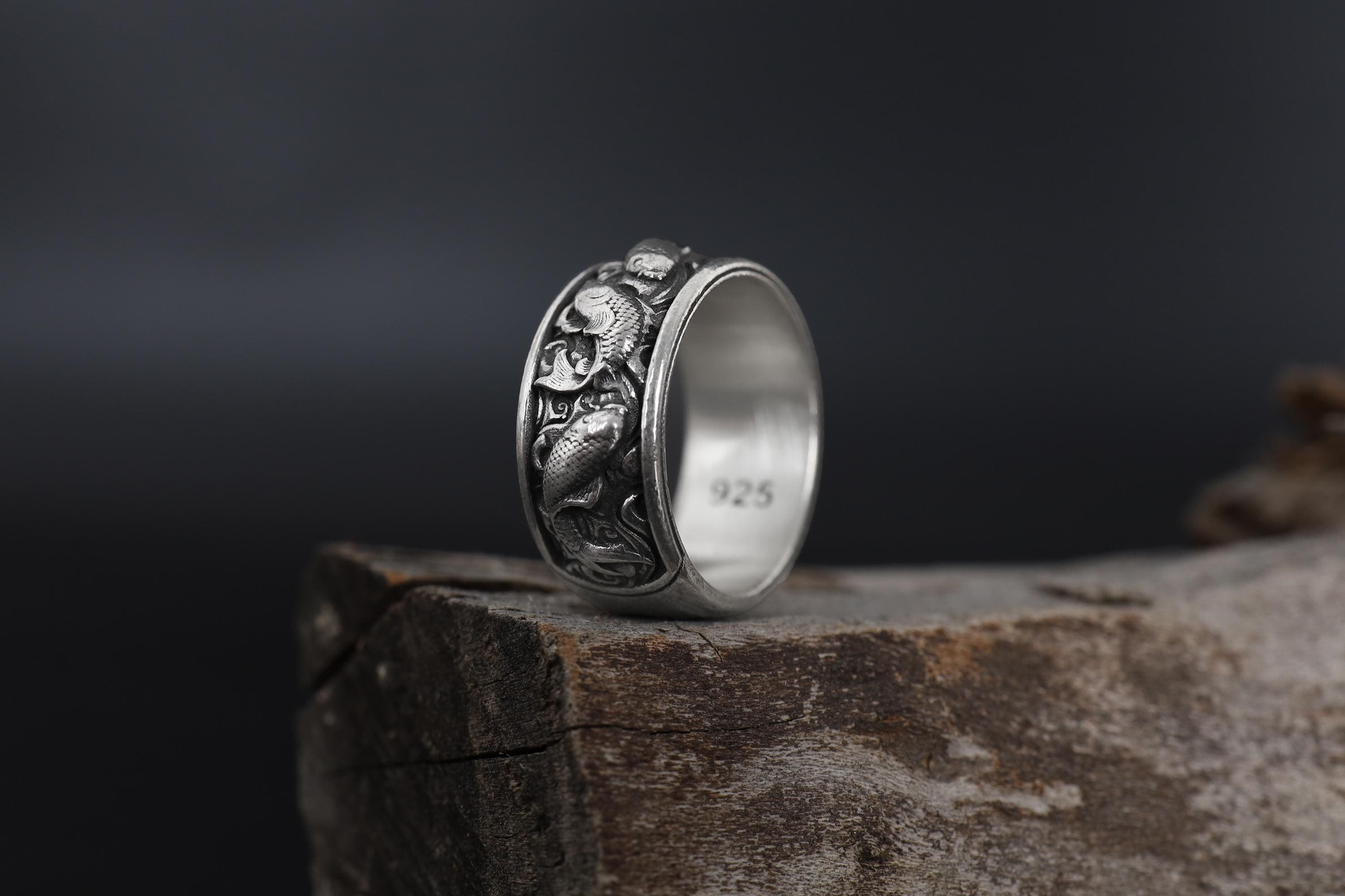 This Koi fish ring for men is a bold and meaningful design created for those who are drawn to Japanese jewelry, symbolic rings, engraved bands, nature-inspired accessories, and statement gold rings. Featuring detailed Koi carp motifs flowing across the band, this ring represents perseverance, transformation, strength, luck, and forward movement.