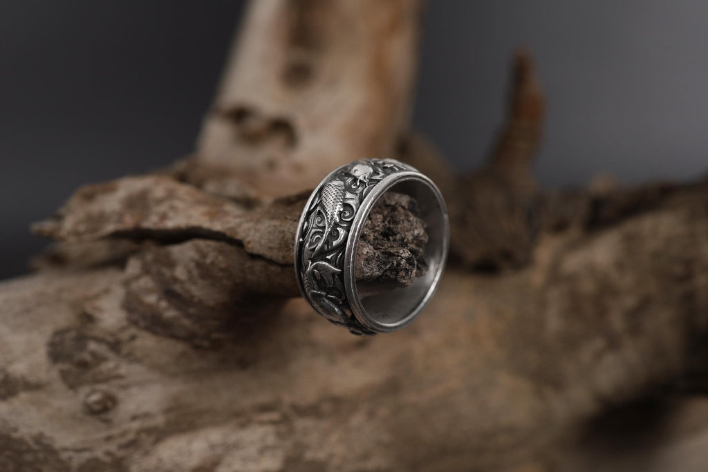 This Koi fish ring for men is a bold and meaningful design created for those who are drawn to Japanese jewelry, symbolic rings, engraved bands, nature-inspired accessories, and statement gold rings. Featuring detailed Koi carp motifs flowing across the band, this ring represents perseverance, transformation, strength, luck, and forward movement.