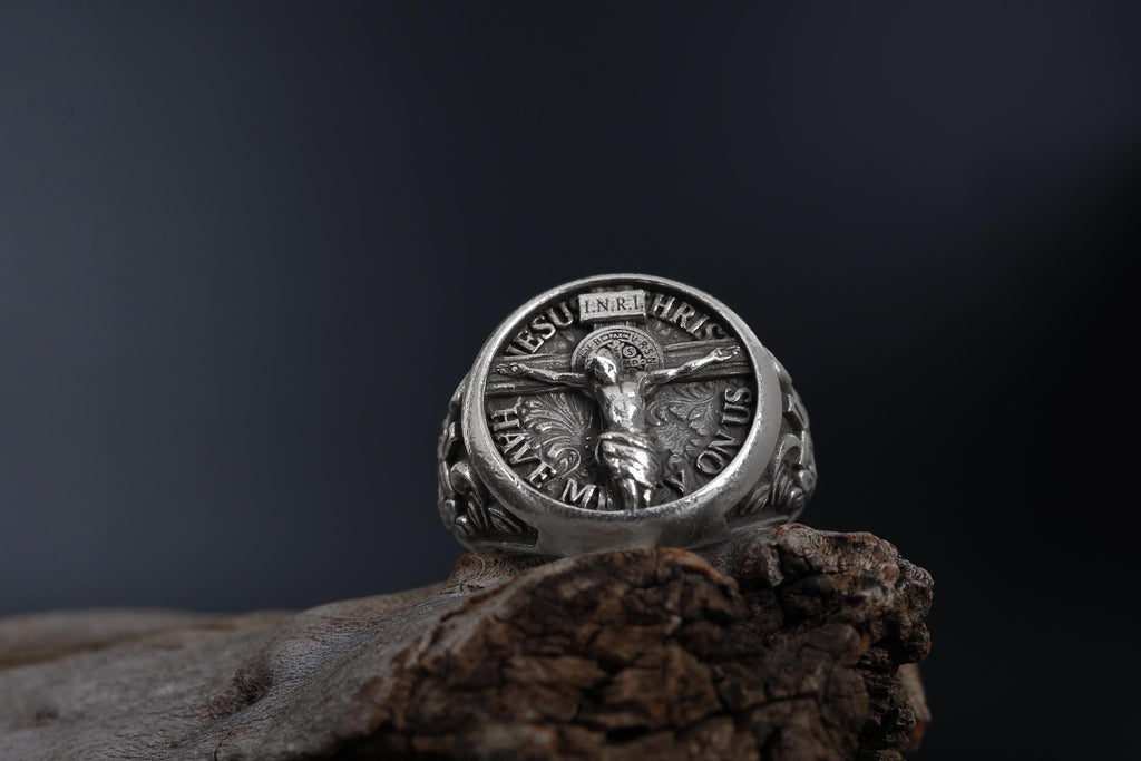 Jesus Crucifix ring, faith inspired religious jewelry, symbolic Christian statement band, and handcrafted bold accessory designed for those who are drawn to devotion, spirituality, faith, and timeless Christian symbolism. This striking ring features a detailed depiction of Jesus on the Holy Crucifix, carefully engraved onto a bold signet face, creating a powerful appearance inspired by Christian tradition, sacred art, and enduring faith.