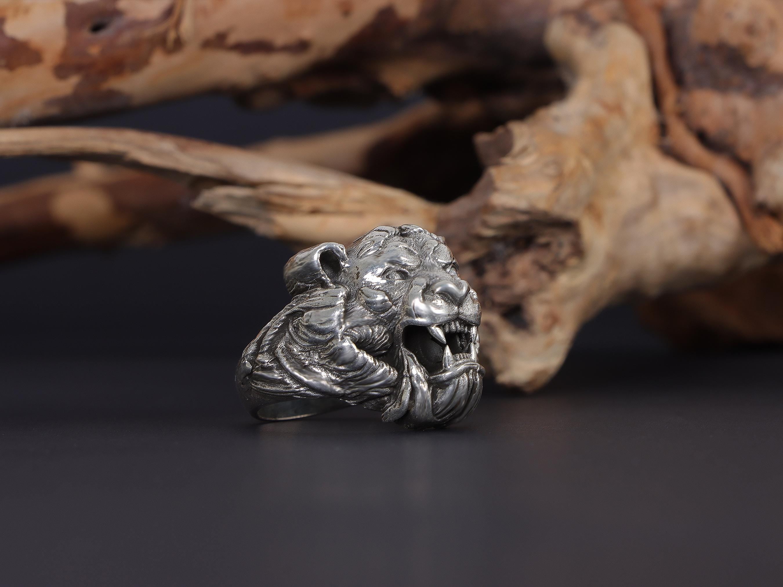 Roaring tiger head ring, sterling silver fierce statement jewelry, symbolic tiger signet band, and handcrafted bold accessory designed for those who are drawn to strength, courage, independence, and untamed energy. This striking ring features a detailed roaring tiger head motif framed within a bold statement structure, creating a look that feels wild, fearless, and deeply symbolic.