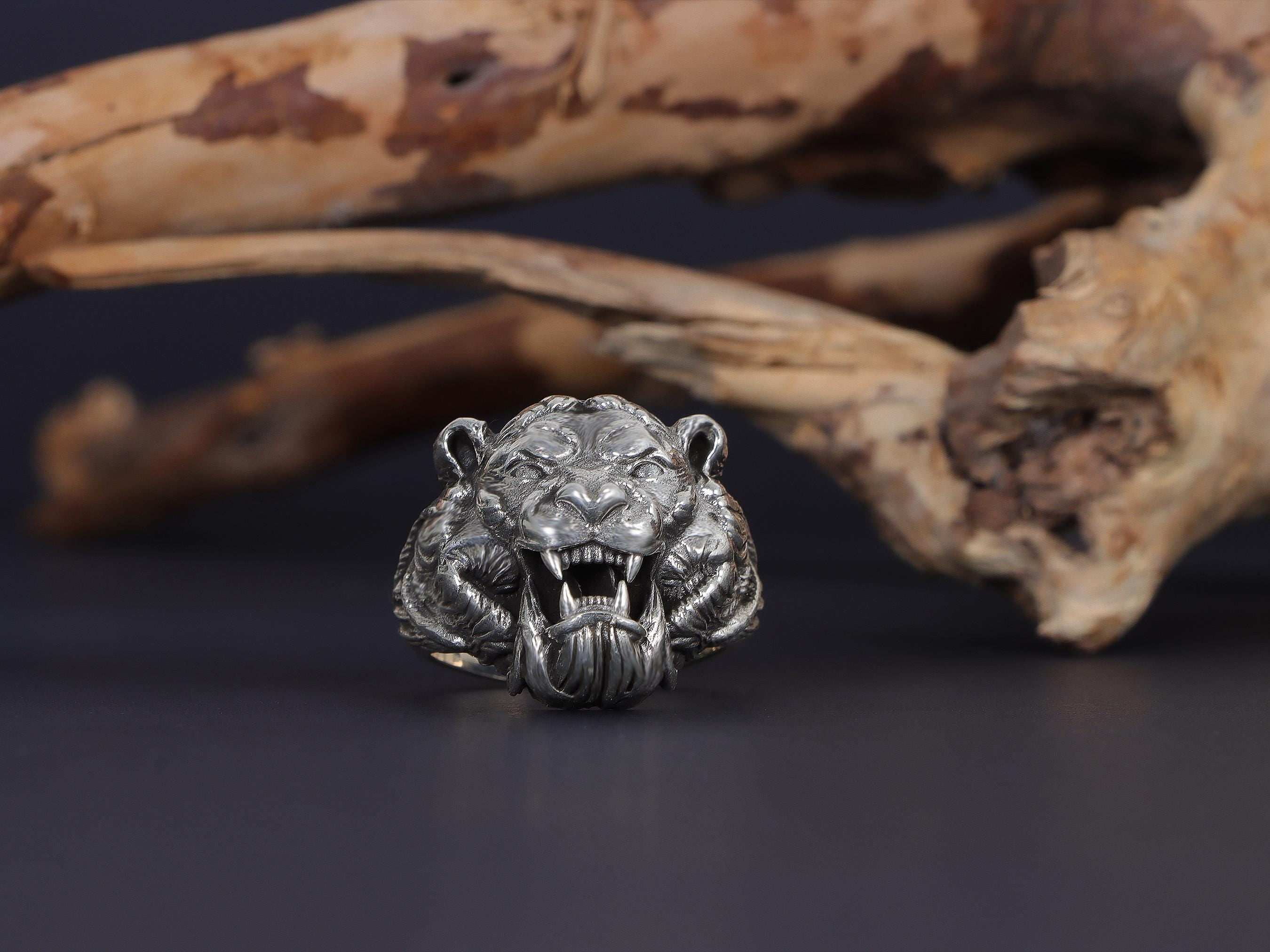 Roaring tiger head ring, sterling silver fierce statement jewelry, symbolic tiger signet band, and handcrafted bold accessory designed for those who are drawn to strength, courage, independence, and untamed energy. This striking ring features a detailed roaring tiger head motif framed within a bold statement structure, creating a look that feels wild, fearless, and deeply symbolic.