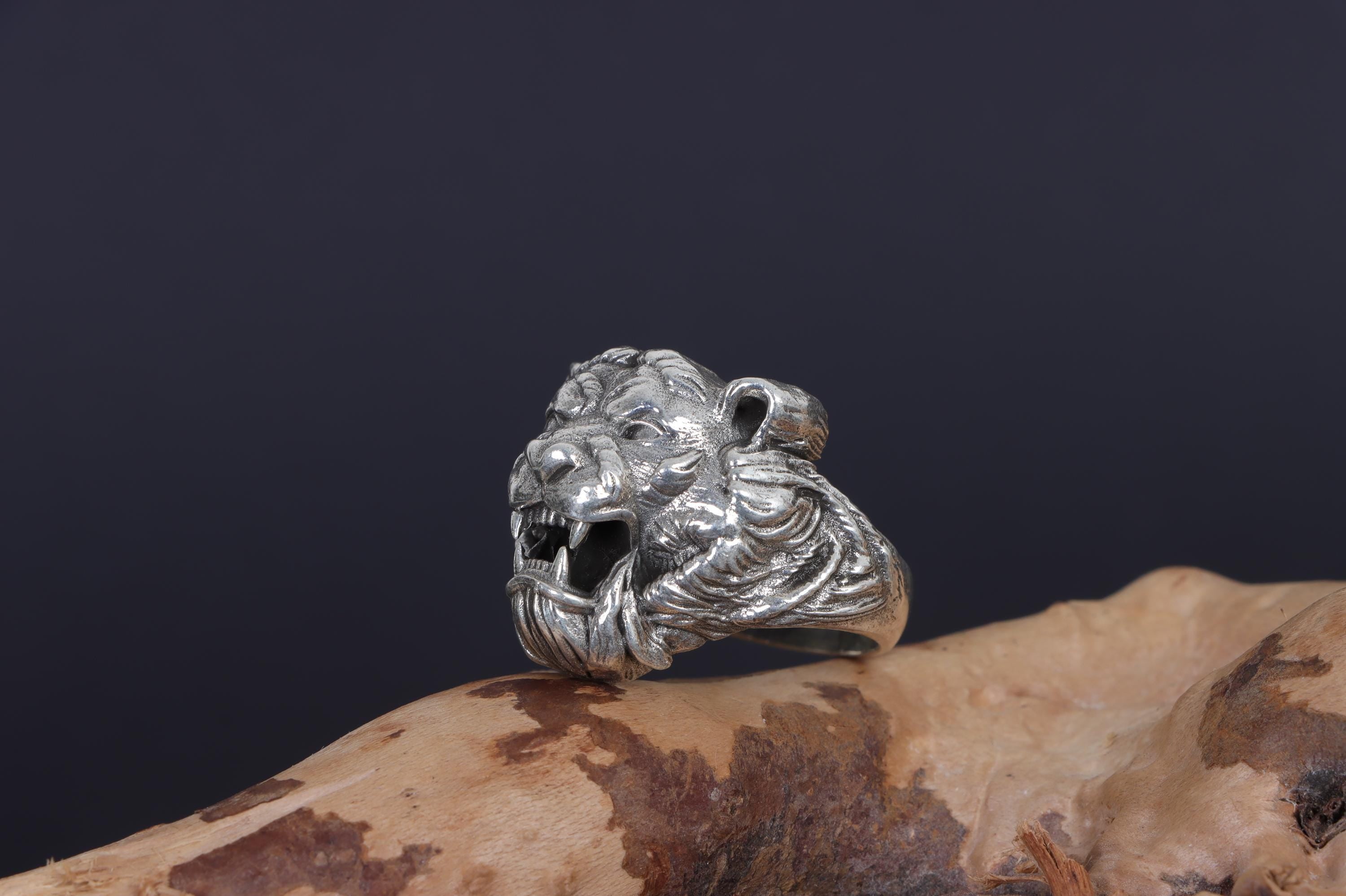 Roaring tiger head ring, sterling silver fierce statement jewelry, symbolic tiger signet band, and handcrafted bold accessory designed for those who are drawn to strength, courage, independence, and untamed energy. This striking ring features a detailed roaring tiger head motif framed within a bold statement structure, creating a look that feels wild, fearless, and deeply symbolic.