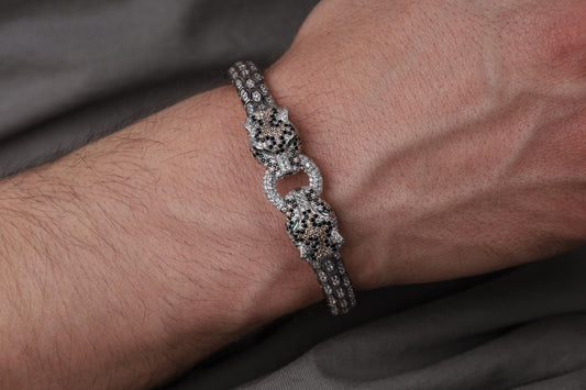 Silver Panther bracelet for men, sterling silver panther bracelet, panther head jewelry, luxury animal bracelet, men's statement bracelet, and handcrafted bold accessory designed for those who appreciate strength, confidence, and timeless craftsmanship. This striking bracelet features detailed panther heads connected by an intricately textured band, creating a commanding design inspired by the elegance, agility, and dominance of one of nature