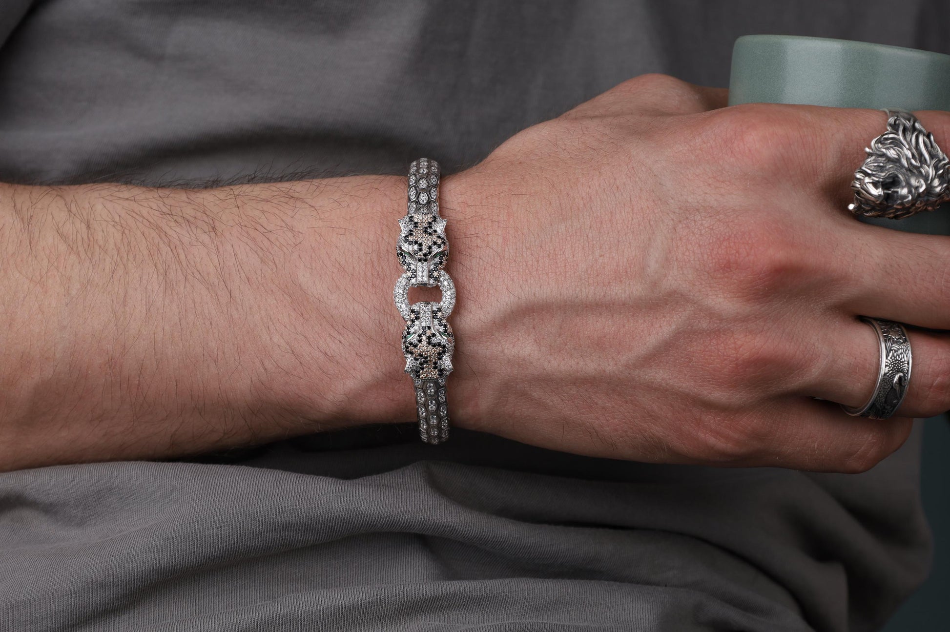 Silver Panther bracelet for men, sterling silver panther bracelet, panther head jewelry, luxury animal bracelet, men's statement bracelet, and handcrafted bold accessory designed for those who appreciate strength, confidence, and timeless craftsmanship. This striking bracelet features detailed panther heads connected by an intricately textured band, creating a commanding design inspired by the elegance, agility, and dominance of one of nature