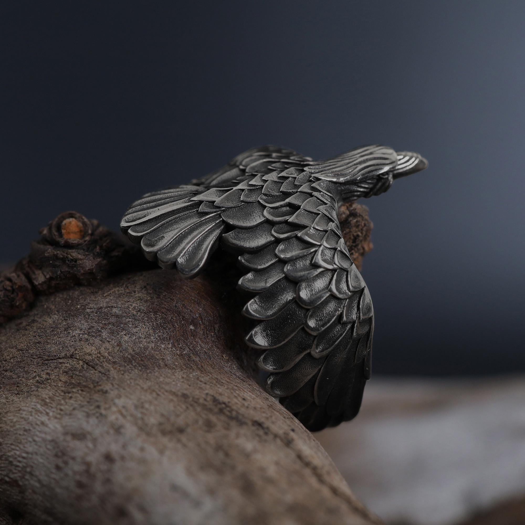 This raven ring for men is a bold and highly detailed design inspired by Norse mythology, Viking symbolism, crow jewelry, and statement men’s rings. Featuring a dramatic spread-wing raven motif, this ring captures the power, intelligence, and mystery long associated with the raven. It is an ideal choice for buyers searching for a Viking raven ring, Norse raven ring, crow ring for men, bird statement ring, or a symbolic men’s ring with a strong an