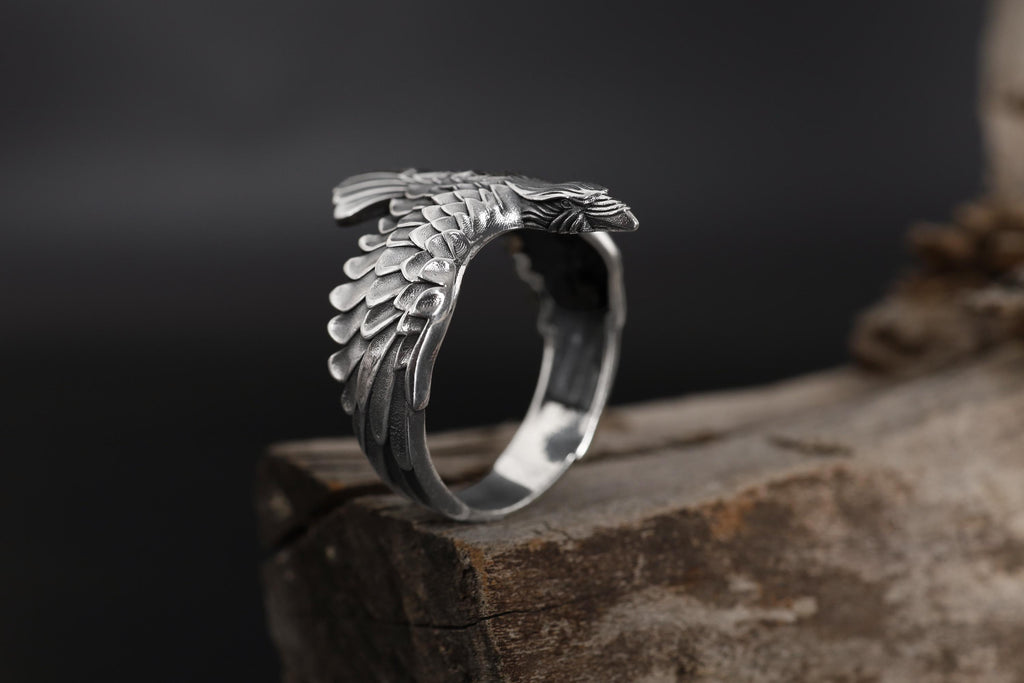 This raven ring for men is a bold and highly detailed design inspired by Norse mythology, Viking symbolism, crow jewelry, and statement men’s rings. Featuring a dramatic spread-wing raven motif, this ring captures the power, intelligence, and mystery long associated with the raven. It is an ideal choice for buyers searching for a Viking raven ring, Norse raven ring, crow ring for men, bird statement ring, or a symbolic men’s ring with a strong an