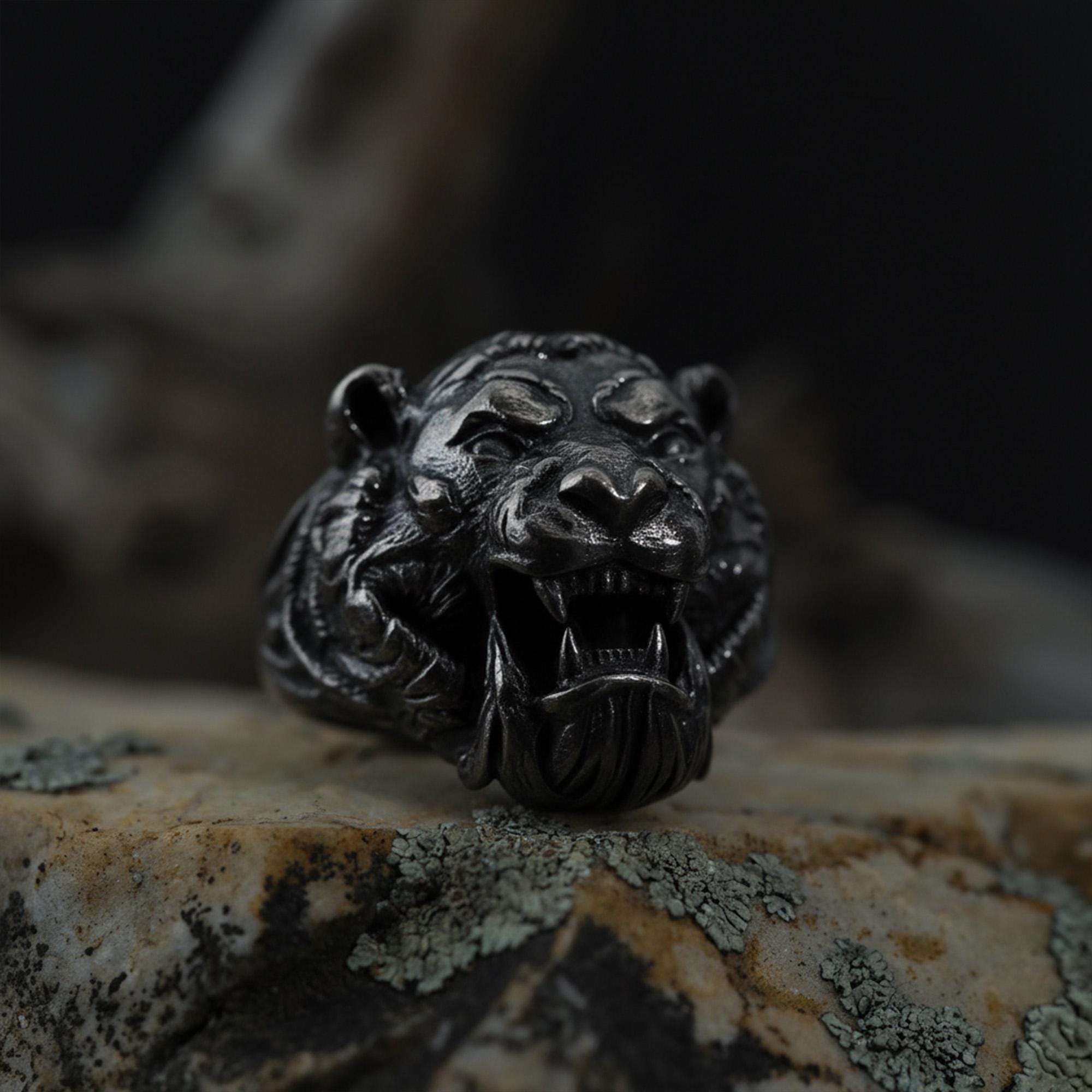 Roaring tiger head ring, sterling silver fierce statement jewelry, symbolic tiger signet band, and handcrafted bold accessory designed for those who are drawn to strength, courage, independence, and untamed energy. This striking ring features a detailed roaring tiger head motif framed within a bold statement structure, creating a look that feels wild, fearless, and deeply symbolic.