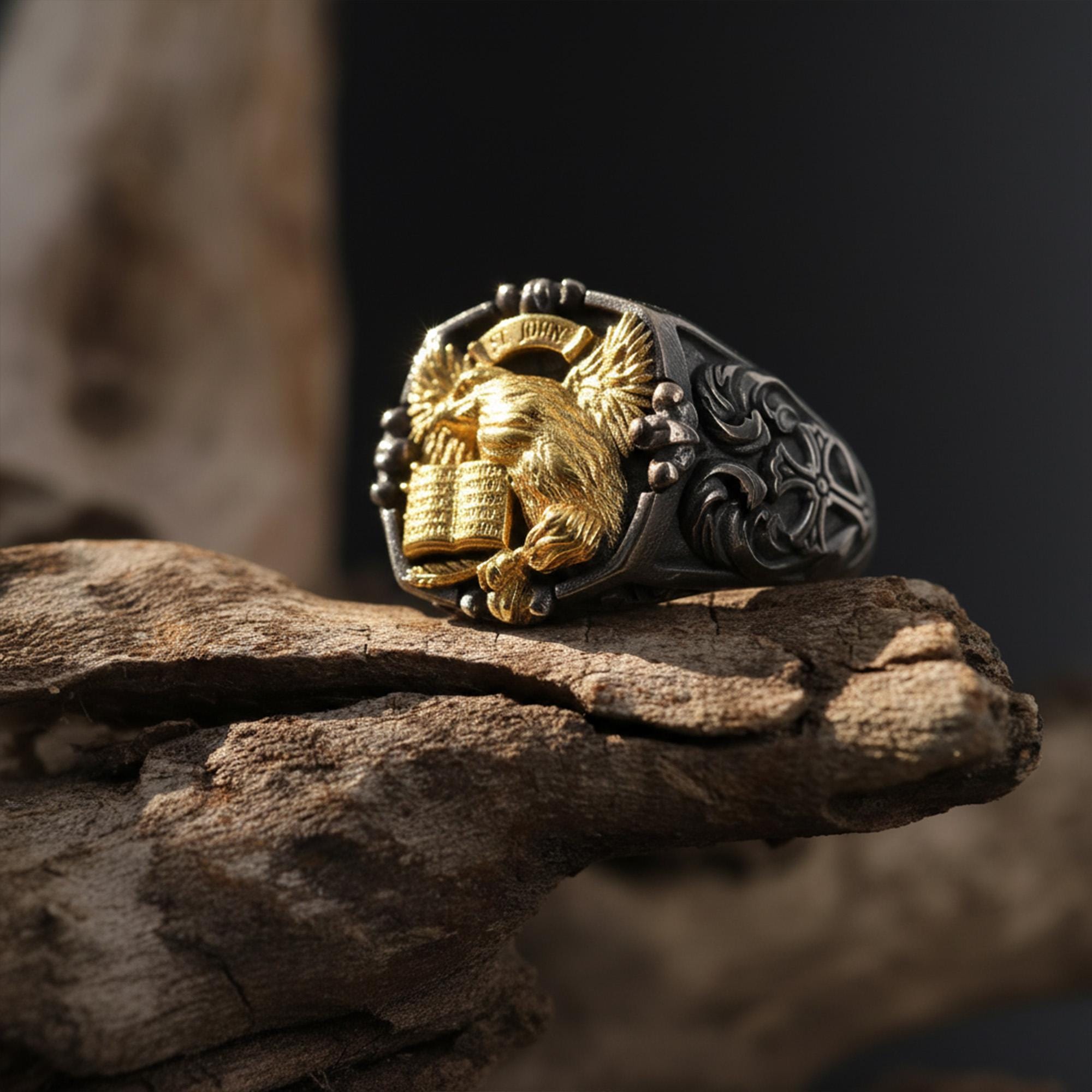 St. John eagle signet ring, sterling silver Christian jewelry, symbolic religious statement band, and handcrafted bold accessory designed for those who are drawn to faith, wisdom, and spiritual strength. This striking ring features a detailed eagle motif inspired by Saint John symbolism, framed within a bold signet structure that creates a look both sacred and powerful.