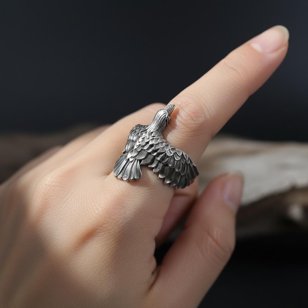 This raven ring for men is a bold and highly detailed design inspired by Norse mythology, Viking symbolism, crow jewelry, and statement men’s rings. Featuring a dramatic spread-wing raven motif, this ring captures the power, intelligence, and mystery long associated with the raven. It is an ideal choice for buyers searching for a Viking raven ring, Norse raven ring, crow ring for men, bird statement ring, or a symbolic men’s ring with a strong an