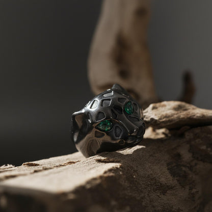 Emerald eyes leopard head ring, panther inspired statement jewelry, symbolic big cat signet band, and handcrafted bold accessory designed for those who are drawn to power, confidence, and fierce elegance. This striking ring features a detailed leopard head motif with vivid emerald stone eyes, creating a luxurious and commanding appearance inspired by wild feline strength and timeless masculine style.
