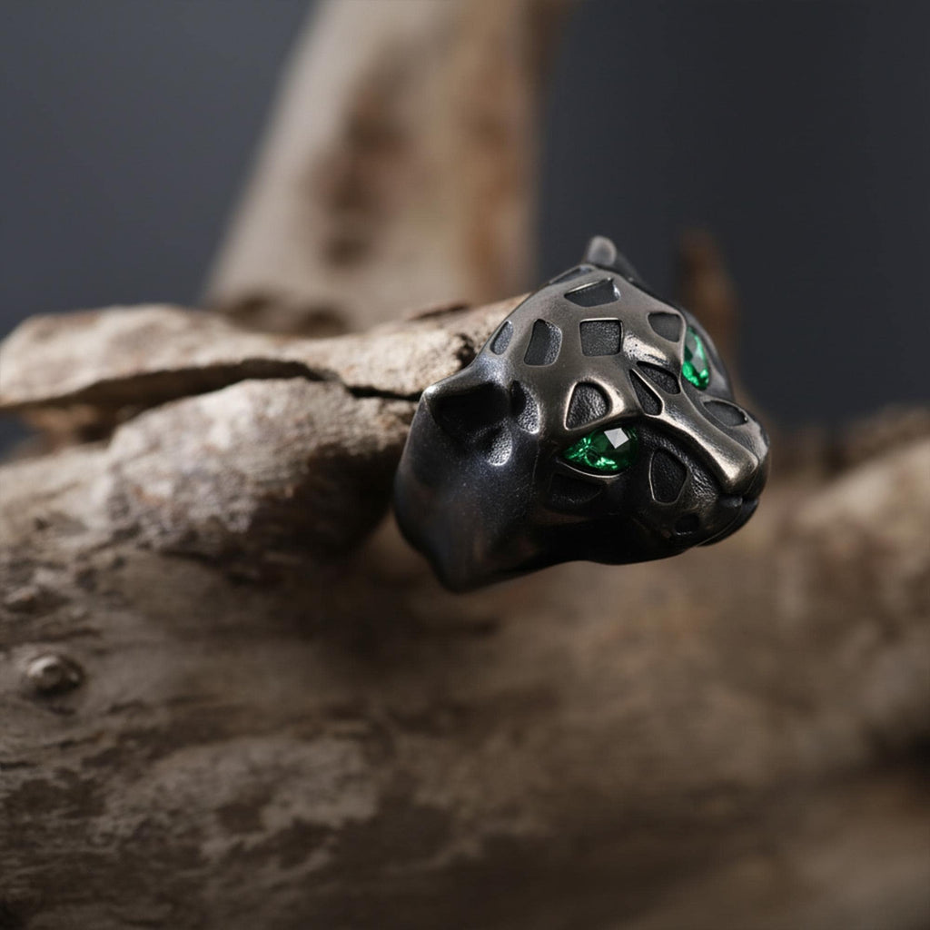 Emerald eyes leopard head ring, panther inspired statement jewelry, symbolic big cat signet band, and handcrafted bold accessory designed for those who are drawn to power, confidence, and fierce elegance. This striking ring features a detailed leopard head motif with vivid emerald stone eyes, creating a luxurious and commanding appearance inspired by wild feline strength and timeless masculine style.