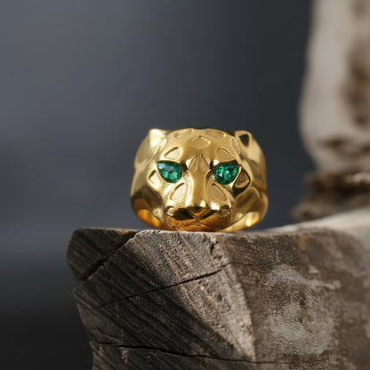 Emerald eyes leopard head ring, panther inspired statement jewelry, symbolic big cat signet band, and handcrafted bold accessory designed for those who are drawn to power, confidence, and fierce elegance. This striking ring features a detailed leopard head motif with vivid emerald stone eyes, creating a luxurious and commanding appearance inspired by wild feline strength and timeless masculine style.