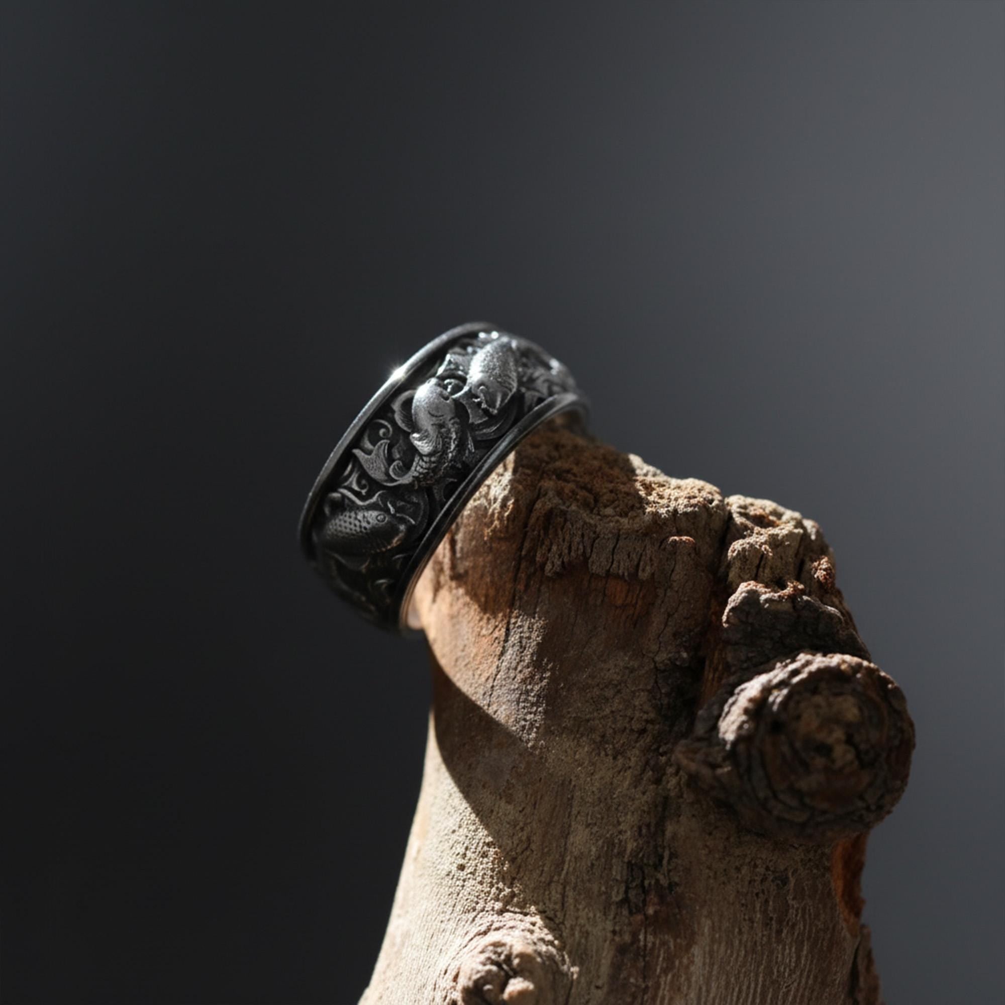 This Koi fish ring for men is a bold and meaningful design created for those who are drawn to Japanese jewelry, symbolic rings, engraved bands, nature-inspired accessories, and statement gold rings. Featuring detailed Koi carp motifs flowing across the band, this ring represents perseverance, transformation, strength, luck, and forward movement.